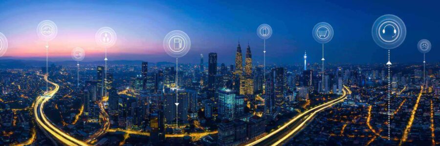 Smart city at night with interconnected digital icons-what is iot​